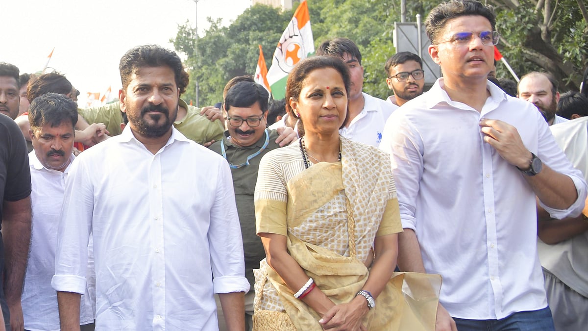 Revanth Reddy (L) with Supriya Sule and Sachin Pilot during the march