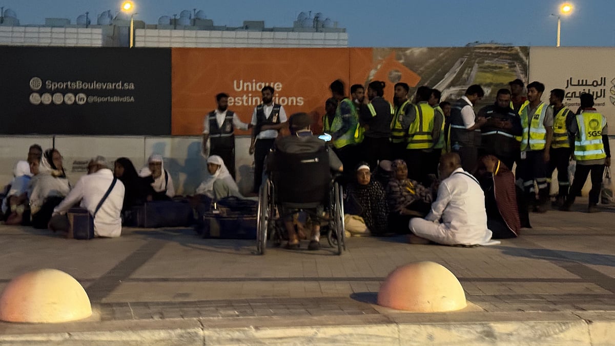 People gather outside a metro station along road to King Khalid International Airport in Riyadh.