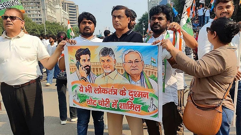Poster against NDA partners at the rally on 12 October