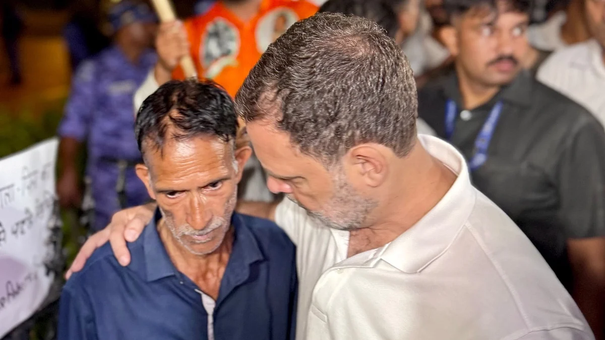 Rahul Gandhi with Ankita's father during a sit-in protest at India Gate, 14 October