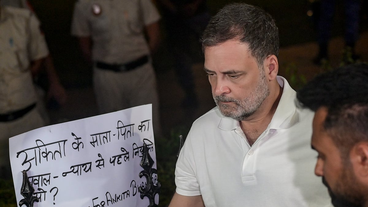 Rahul Gandhi joins Ankita Bhandari's parents during a sit-in protest in New Delhi.