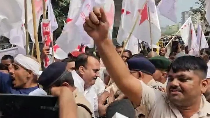 Demonstrators raise slogans against Election Commission and central government.