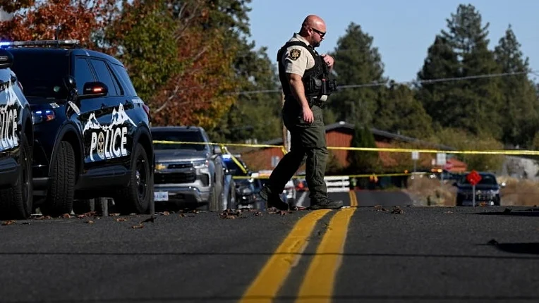Armed with a long gun, the teenager shot through locked doors to enter the school.