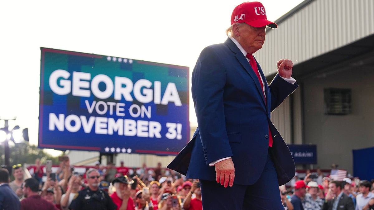 Donald Trump departs a campaign rally in Georgia, 16 Oct