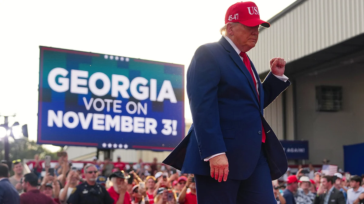 Donald Trump departs a campaign rally in Georgia, 16 Oct