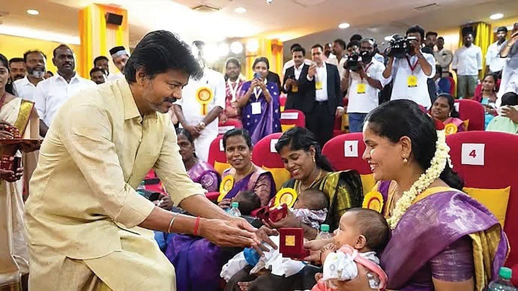 Chief Minister Vijay distributing gold rings to new borns