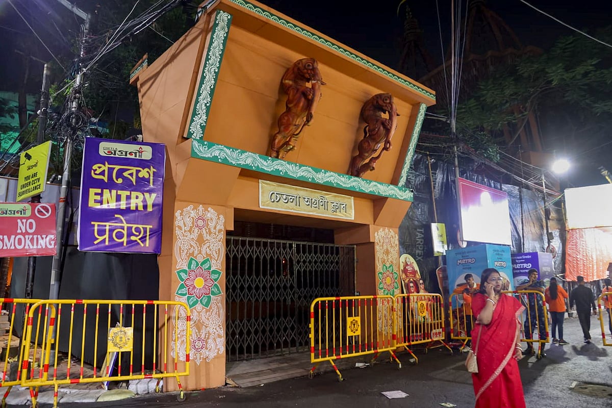 View of the closed entry gate barricaded by police following a stampede-like situation at another venue in the city, at Chetla Agrani Durga Puja pandal, in Kolkata
