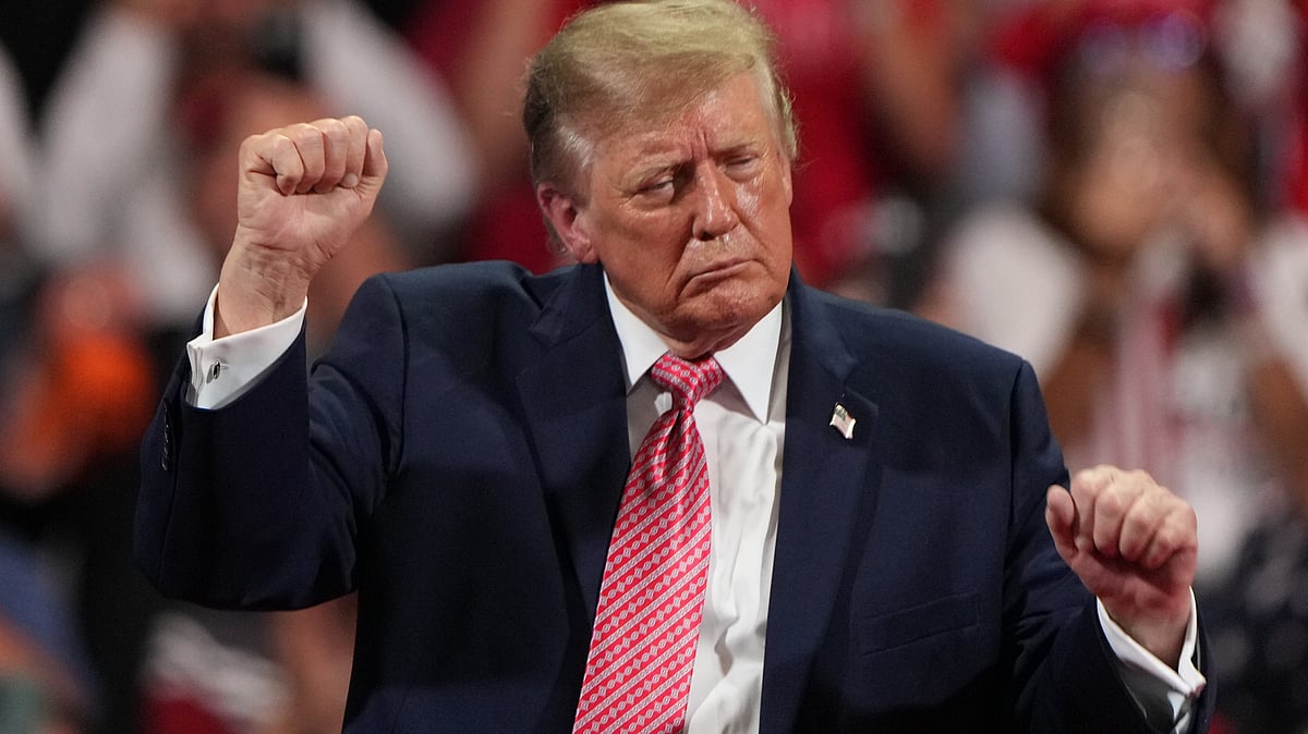 Donald Trump dances during a campaign rally at Heartland Credit Union Arena in Park City, Kansas.