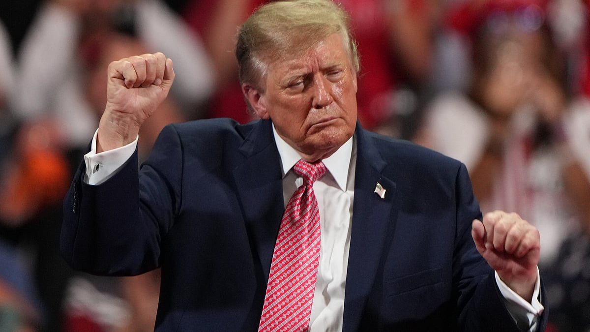 Donald Trump dances during a campaign rally at Heartland Credit Union Arena in Park City, Kansas.