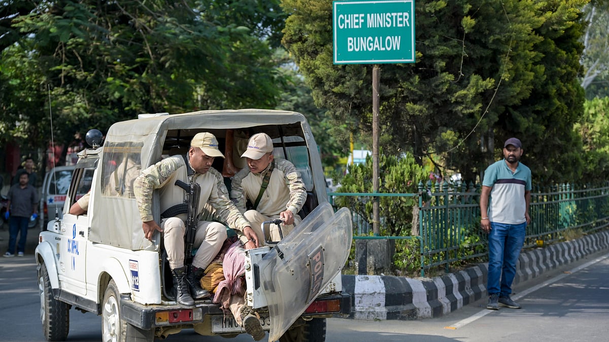 Security forces near chief minister’s residence in Imphal.