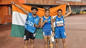 Time for Tricolour: Simran Sharma (centre) with Tejalben Damor, the bronze medallist, on Tuesday