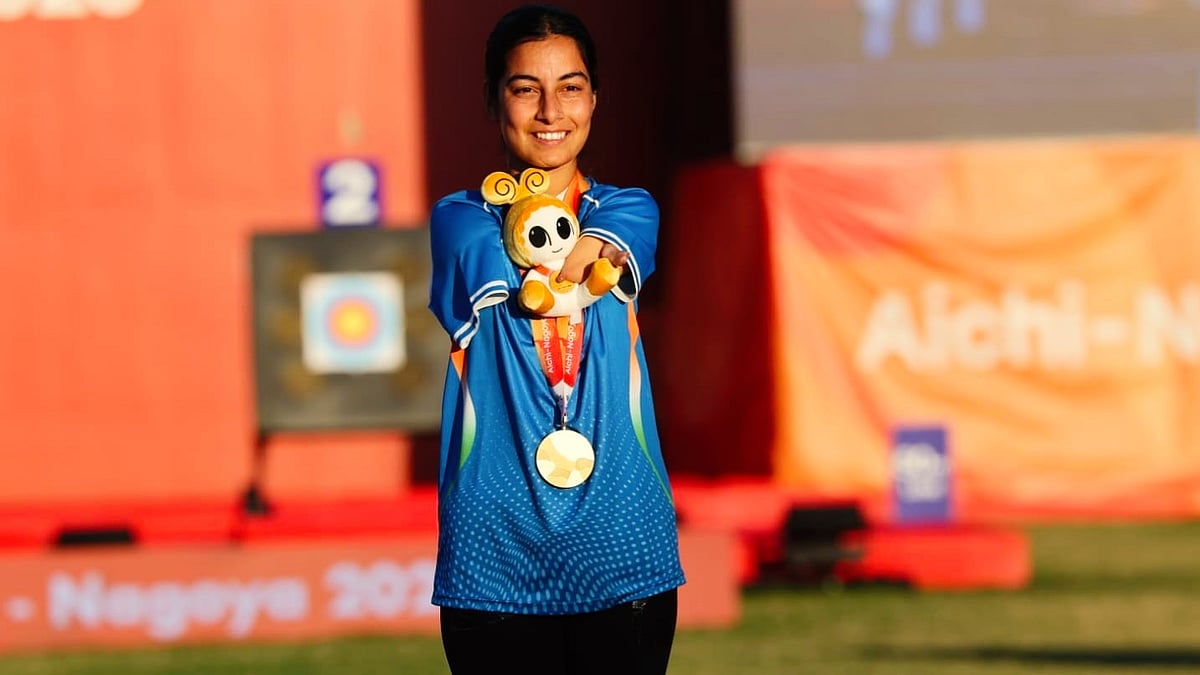 Golden girl: Sheetal Devi flashes one of her two gold medals on the podium