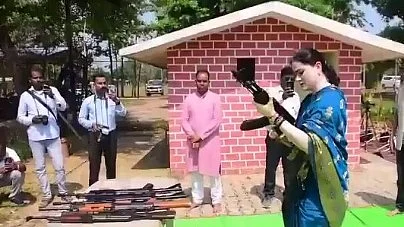 Sharma was seen firing several rounds from the rifle.