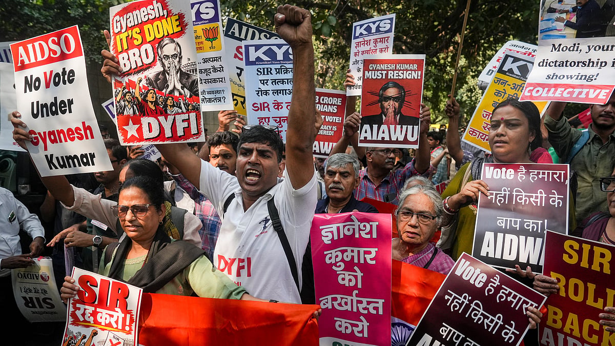 People protest in New Delhi against alleged voter deletions and the SIR of electoral rolls.