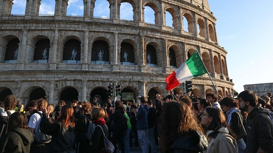 Demonstrators march past Rome’s Colosseum during an anti-war protest.