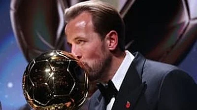 Sealed with a kiss: Harry Kane with the Ballon d'Or trophy