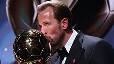 Sealed with a kiss: Harry Kane with the Ballon d'Or trophy