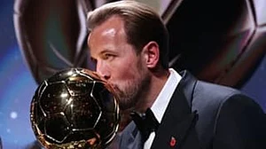 Sealed with a kiss: Harry Kane with the Ballon d'Or trophy