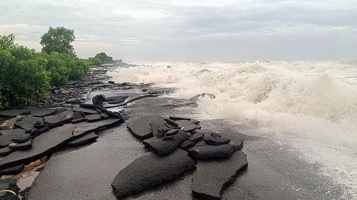Cyclone Arnab damages Uppada Beach Road as strong waves hurl rocks ashore.