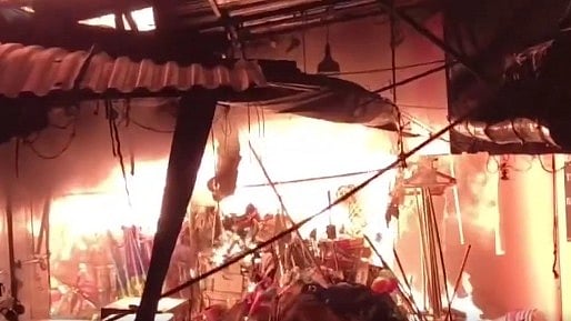 Vendors attempted to rescue their stock as the fire spread through the market.