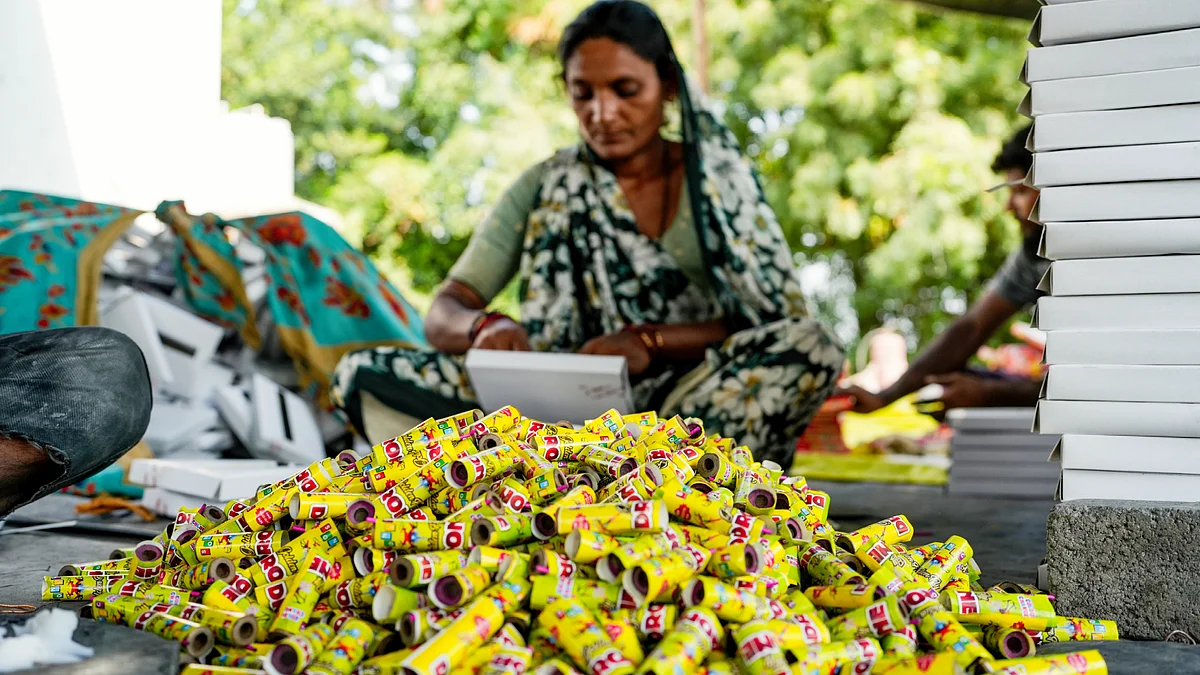 A worker makes firecrackers ahead of Diwali at a factory unit in Ahmedabad, 19 Oct