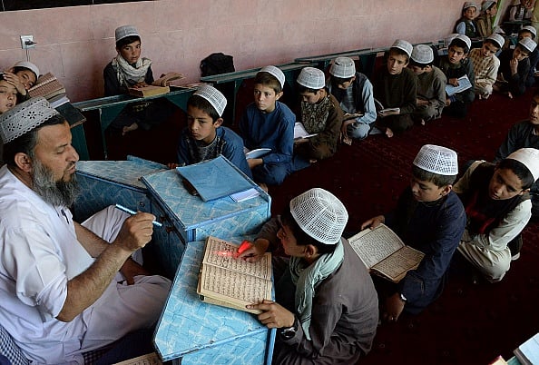 उत्तर प्रदेश के एक मदरसे में पढ़ते बच्चे /फोटो - Getty Images