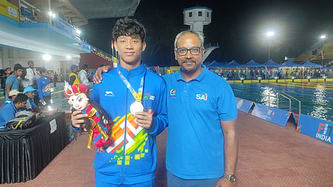 Tirthank Pegu with coach Partha Pratim Majumder.