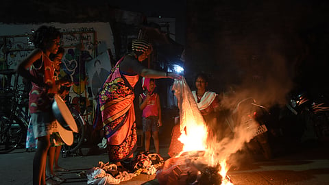 People burn waste and unused clothes during Bhogi ahead of Pongal in Chennai.