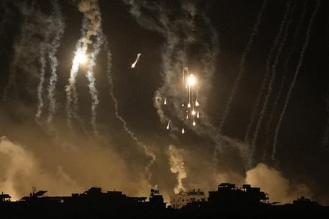 Smoke and flares rise over Gaza City during an Israeli strike in the Gaza Strip, as seen from southern Israel, Friday Nov. 10, 2023. 