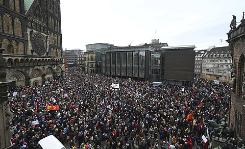 Thousands gather to demonstrate against right-wing extremism. in the market square in Bremen, Germany, Sunday, Jan 21, 2024.