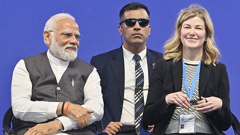 Prime Minister Narendra Modi with Boeing COO Stephanie Pope looks on, in Bengaluru.