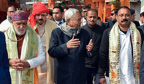 Bihar CM Nitish Kumar (C) along with Union Minister Ashwini Choubey (L) after offering prayers at the Brahmeshwarnath Temple in Buxar on Saturday.