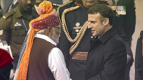 Chief guest French President Emmanuel Macron being welcomed by Prime Minister Narendra Modi on his arrival during the 75th Republic Day celebrations at the Kartavyapath, in New Delhi, on Jan. 26, 2024. 