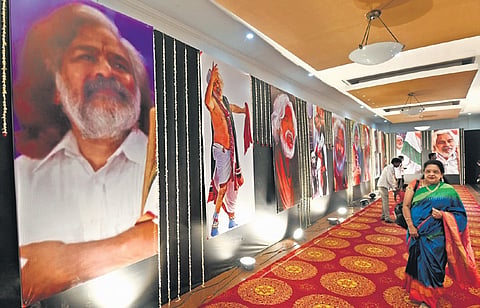 Visitors go through the  Praja Yuddha Nauka Gaddar photo exhibition inaugurated by the chief minister at Ravindra Bharathi in Hyderabad on Wednesday