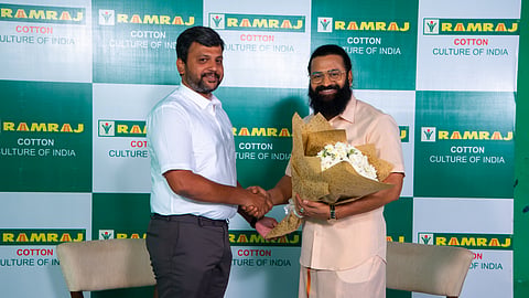 Ramraj Cotton MD Arun Eashwar with 'Kantara' movie actor Rishabh Shetty.