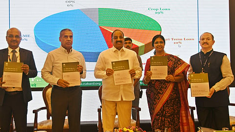 Minister Thummala Nageshwara Rao interacts with Chief General Manager Telangana, NABARD, Susheela Chintala in Hyderabad on Tuesday.