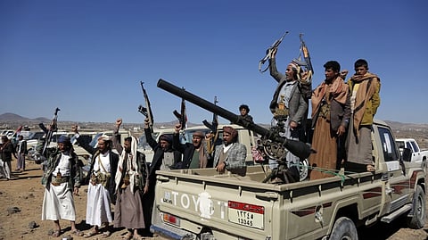 Houthi fighters and tribesmen stage   a rally against the US and the UK strikes on "Houthi-run military sites near Sanaa, Yemen, on Sunday, January 14, 2024.