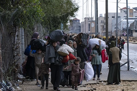 Palestinians arrive in the southern Gaza town of Rafah after fleeing an Israeli ground and air offensive in the nearby city of Khan Younis on Monday, Jan 29, 2024.