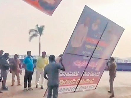 Balakrishna’s followers are seen removing flexis of Jr NTR on Thursday