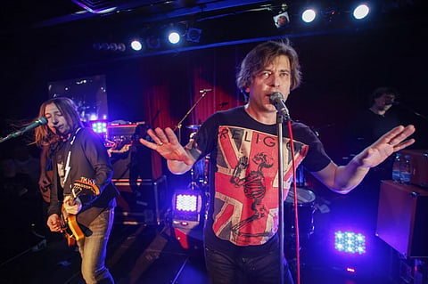 Aleksandr “Shura” Uman, left, and Yegor “Lyova” Bortnik perform during the Bi-2 rock band concert in Moscow, Russia, Thursday, Dec. 1, 2011. 
