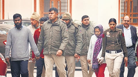Manoranjan D and Neelam Azad, accused in the Parliament security breach case, being produced at the Patiala House court in New Delhi on Wednesday. 
