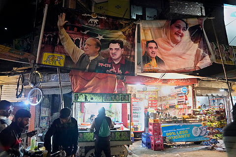 Election campaign poster of Pakistan's former Prime Minister Nawaz Sharif's party are displayed at a market in Lahore, Pakistan, Feb. 5, 2024. 