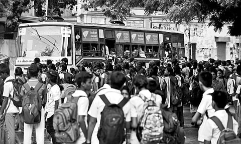A crowd waiting to board MTC buses in Chennai 