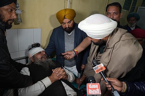 Punjab Congress leader Amrinder Singh Warring meets injured farmers at Rajpura government Hospital. 