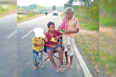 Sebara, his son on a tricycle and grandson while they were on way to the BDO office in Belpada 