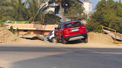 Though police placed barricades to close the narrow passage, motorists use the road after removing them at night. 