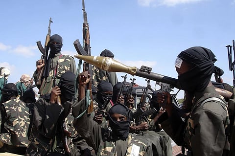 Armed al-Shabab fighters ride on pickup trucks as they prepare to travel into the city, just outside the capital Mogadishu, in Somalia on Dec. 8, 2008. 