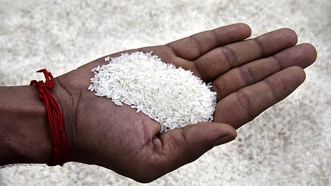 A customer checking the quality of the rice at a departmental store in Chennai.