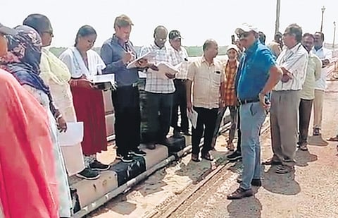 Officials from the Krishna River Management Board and Nagarjuna Sagar Project inspect the dam on Friday during a two-day inspection 