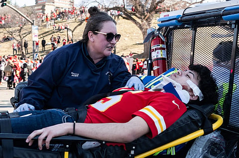 An injured person is aided near the Kansas City Chiefs' Super Bowl LVIII victory parade on February 14, 2024 in Kansas City, Missouri. 